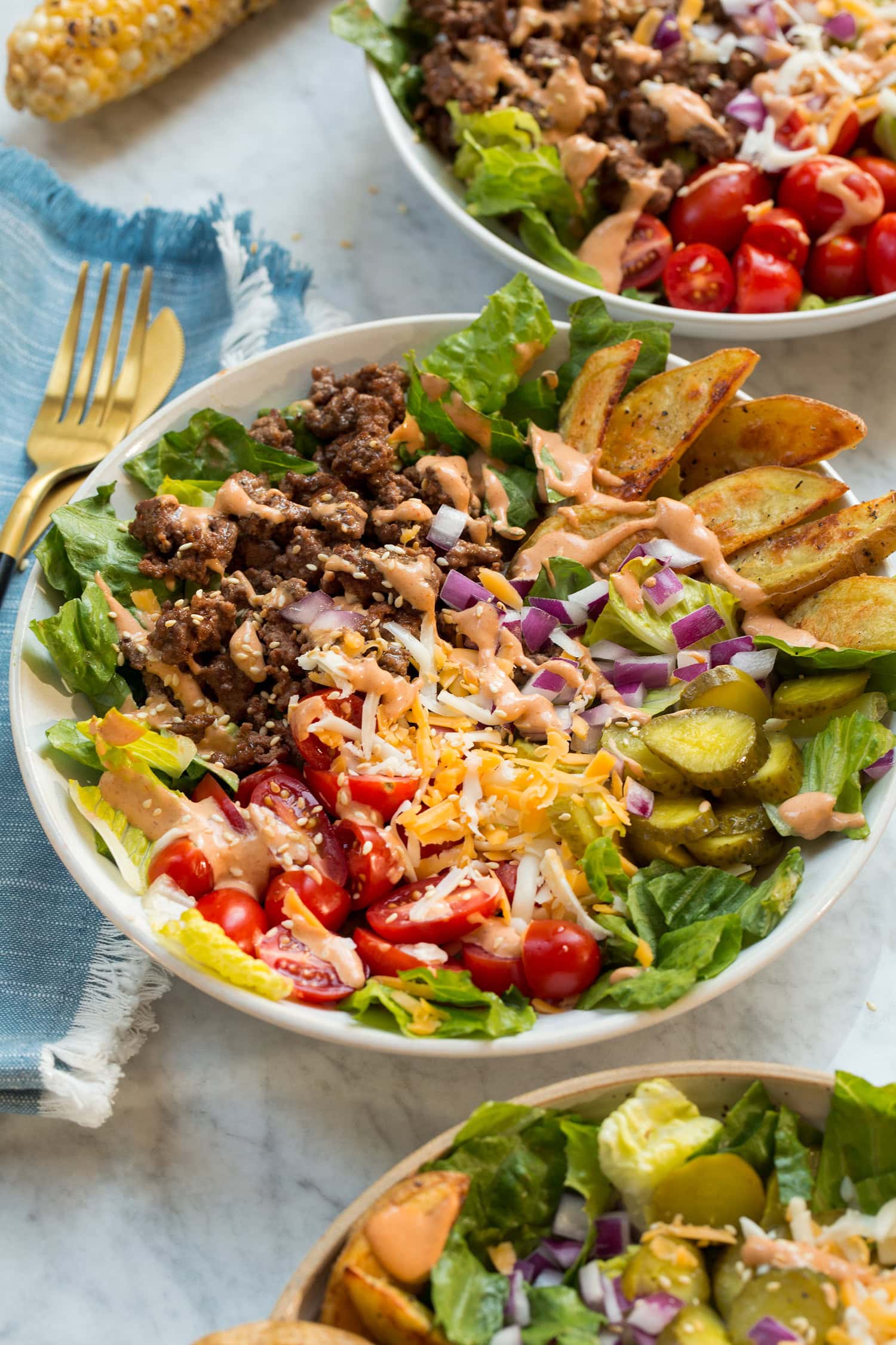 Loaded burger bowls shown from the side.