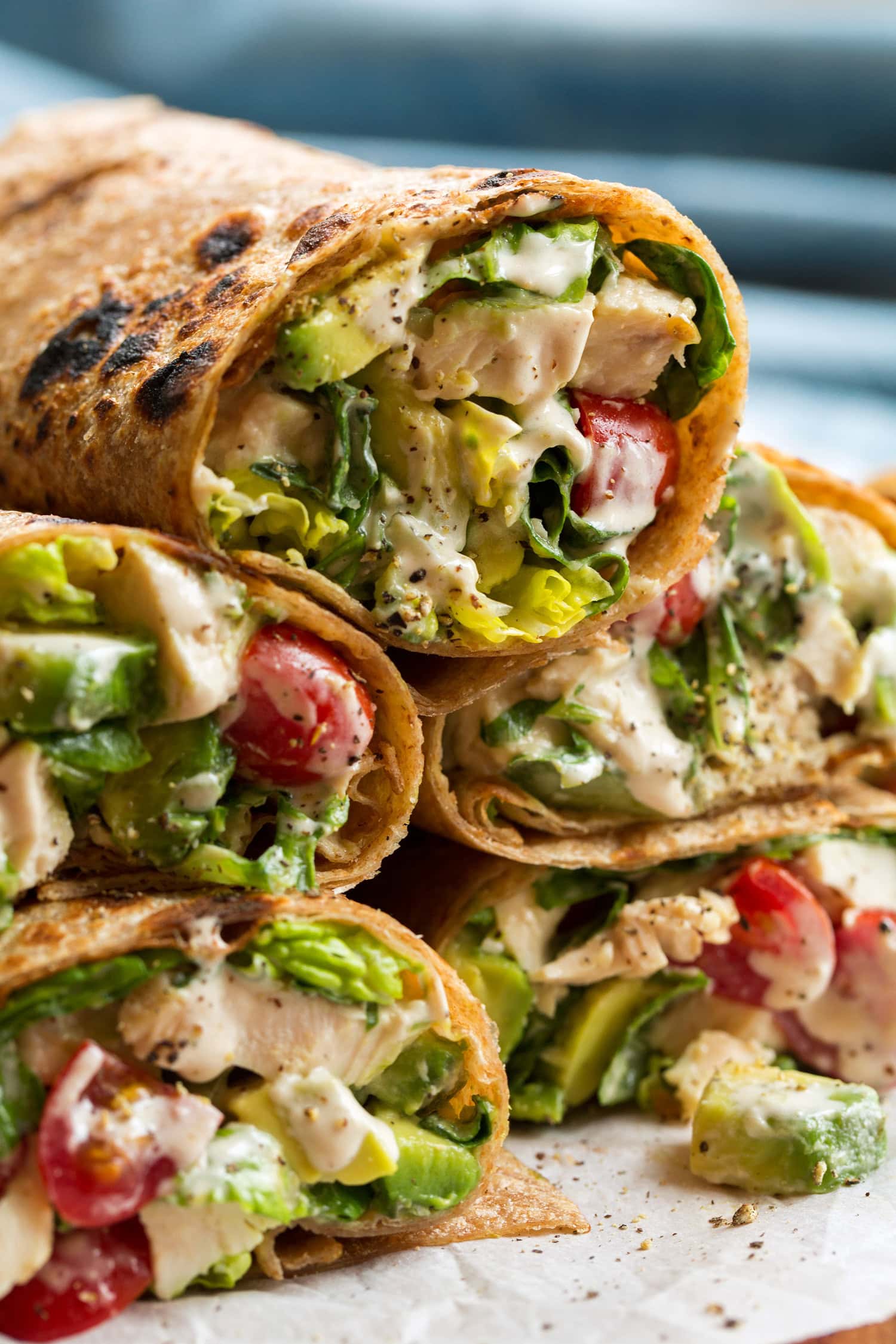 Chicken Caesar Wrap Close up photo of chicken caesar salad wrap in whole wheat tortillas.