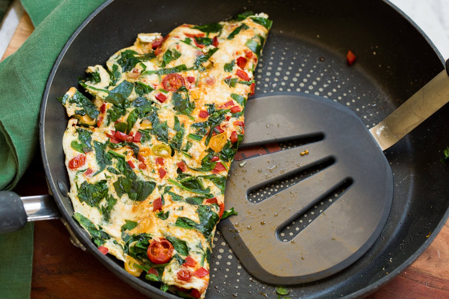 Egg White Omelette Omelette folded in half in skillet.