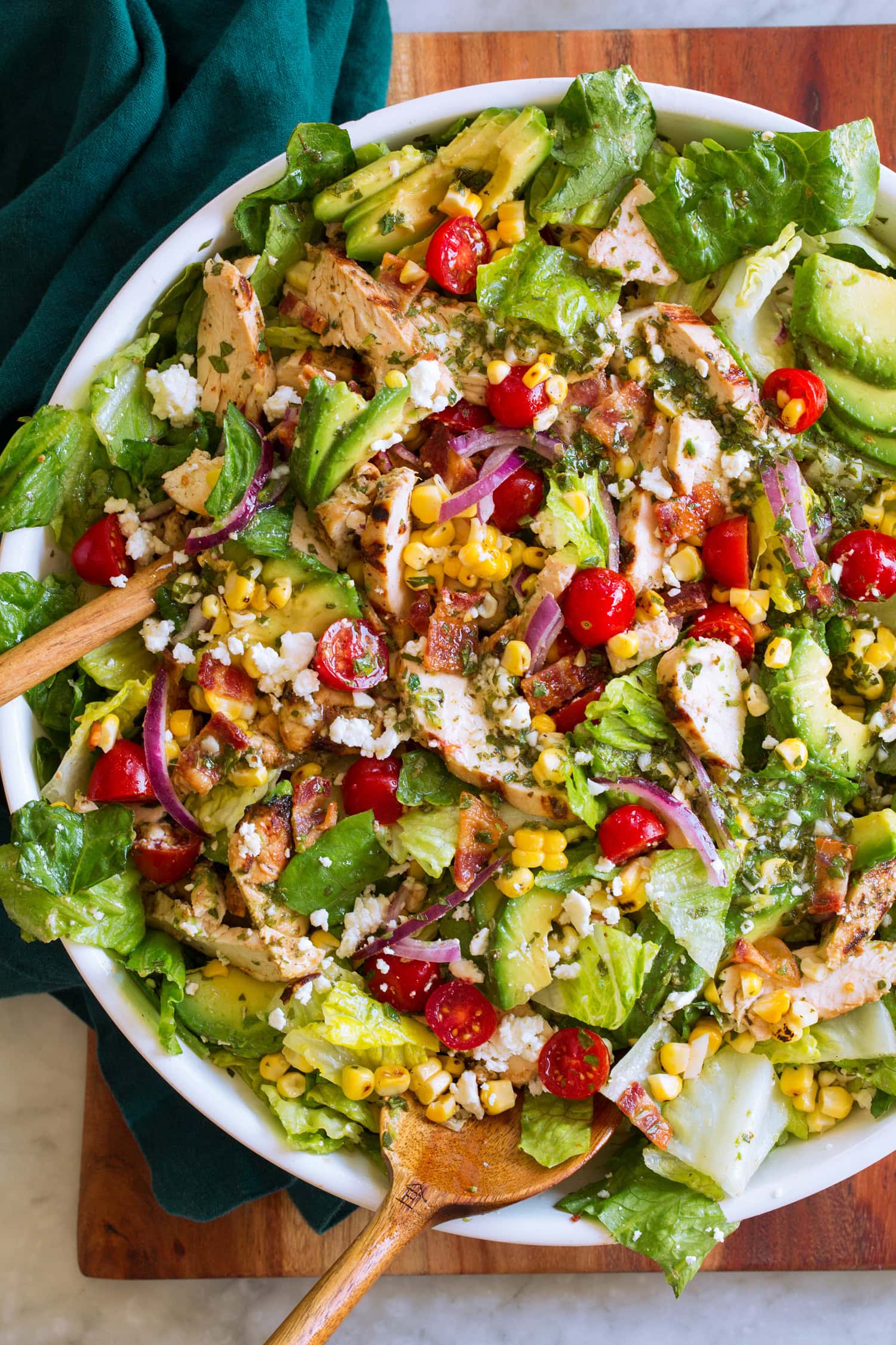 Grilled Chicken Salad Tossed salad with grilled chicken, tomatoes, corn, avocado and romaine lettuce.