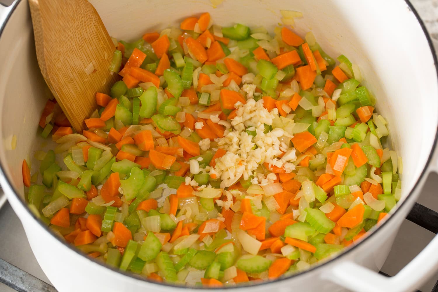 Carrots, onions, celery and garlic sauteed in pot.