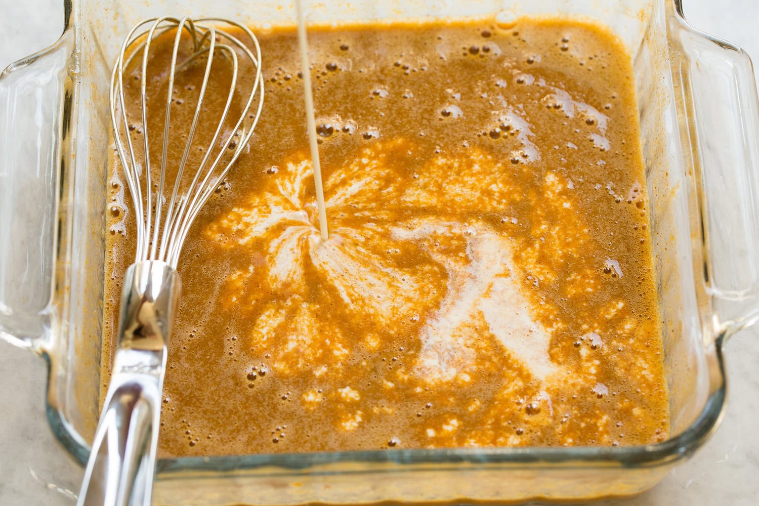 Pumpkin French Toast Pumpkin, eggs, spices, sugar shown mixed and half and half being added.